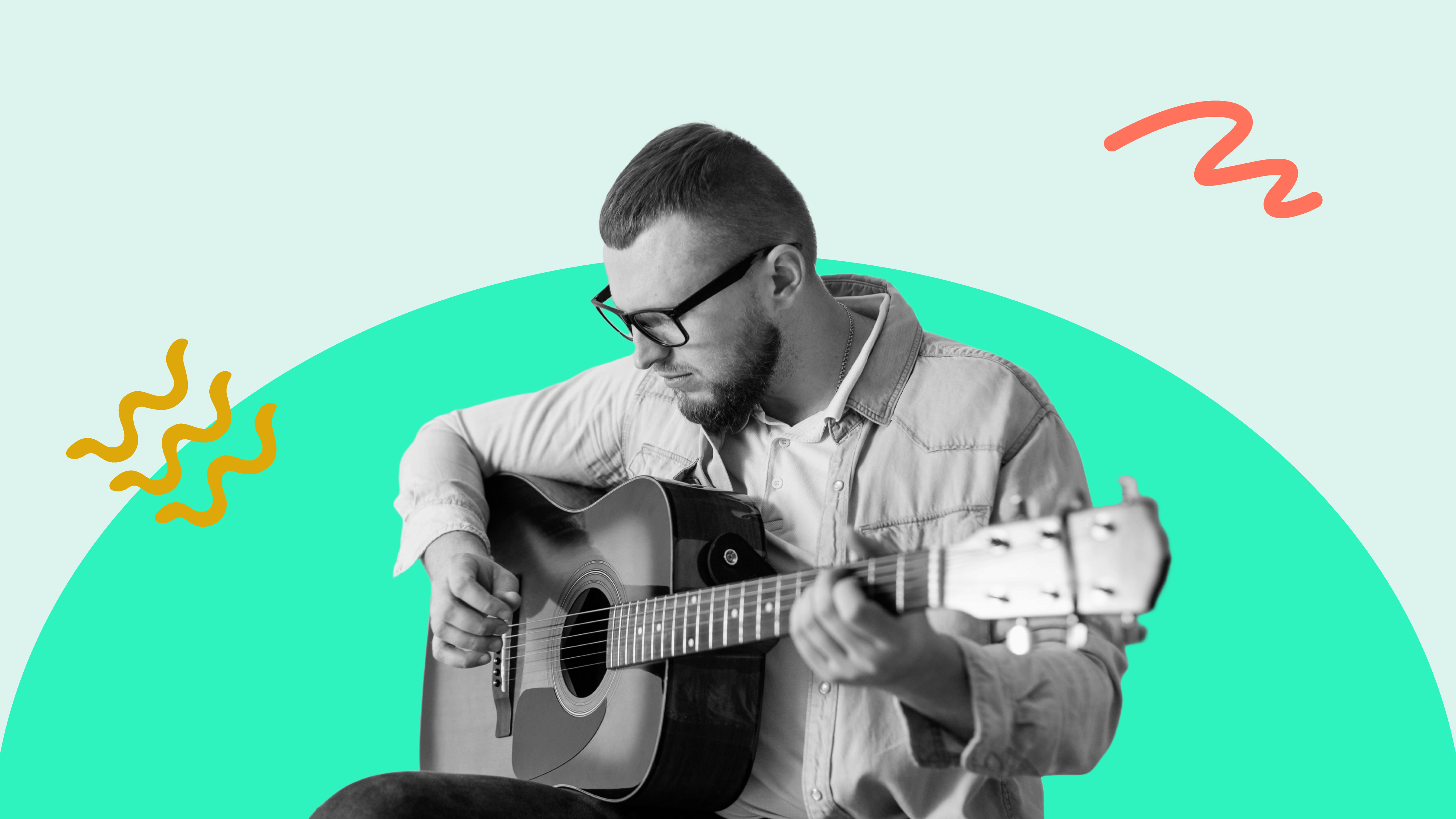 A man learning to play the guitar